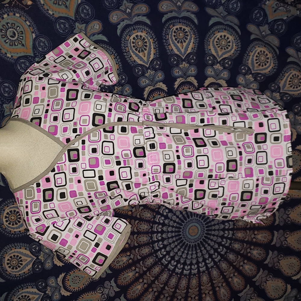 Size small scrub top. Pink, black design